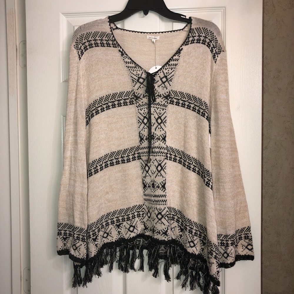 En Creme tan and black sweater